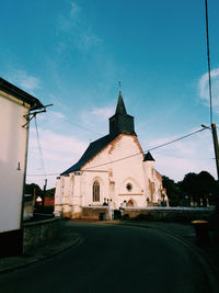 View of buildings against blue sky