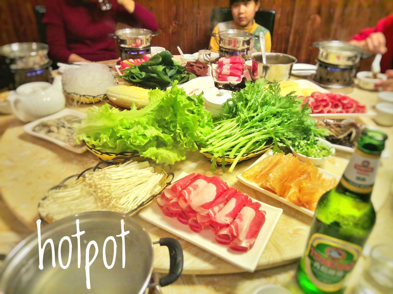 CLOSE-UP OF MEAT AND VEGETABLES ON TABLE