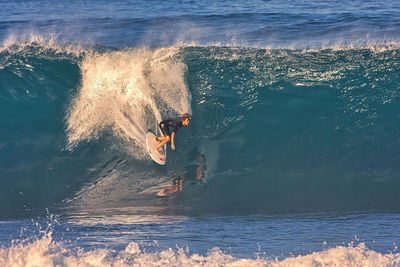 High angle view of man surfing in sea