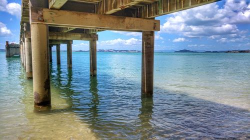 Scenic view of pier over sea against sky