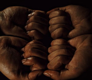 Cropped image of hands with sweat