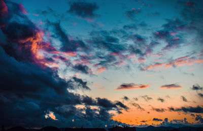 Low angle view of dramatic sky at sunset
