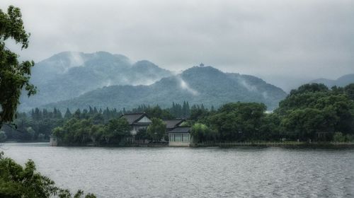 Scenic view of lake with mountains in background