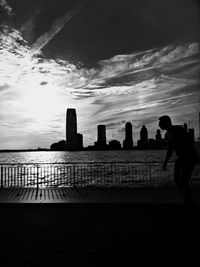 Silhouette of people against clear sky