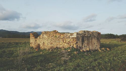 Old ruins against cloudy sky