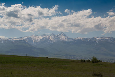 Scenic view of snowcapped mountains against sky