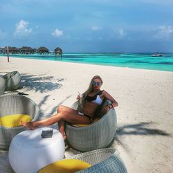 Woman sitting on beach