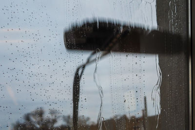 Full frame shot of wet glass window in rainy season