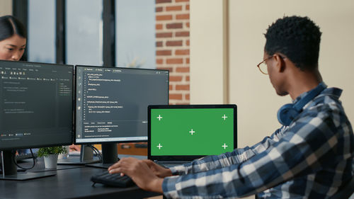 Businessman working on laptop at office