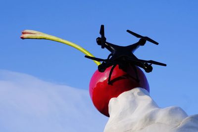 Low angle view of statue against clear blue sky