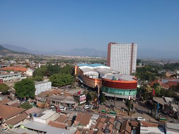 High angle view of buildings in city against clear sky