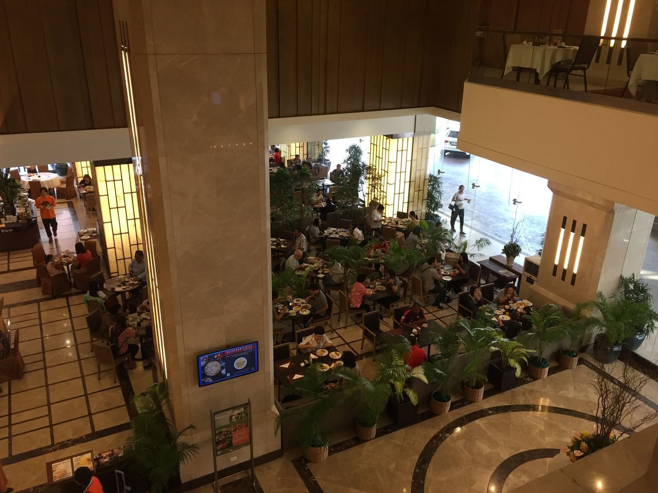 HIGH ANGLE VIEW OF PEOPLE WALKING ON STREET AMIDST BUILDINGS IN CITY