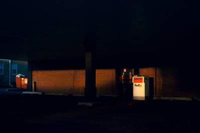 Illuminated building against sky at night