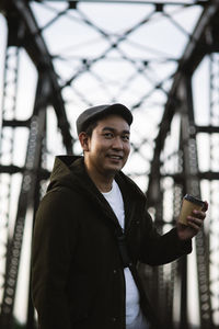 Portrait of young man standing outdoors