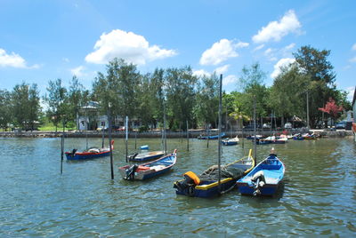 Boats moored on lake