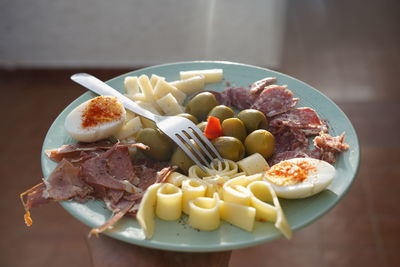 Close-up of breakfast in plate on table