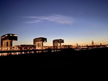 Illuminated buildings in city at night