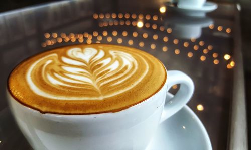 Close-up of cappuccino on table