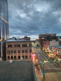 City buildings against cloudy sky