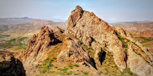 Panoramic view of rock formations against sky