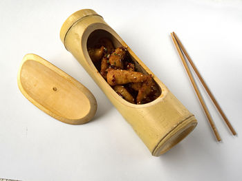 High angle view of food on table against white background