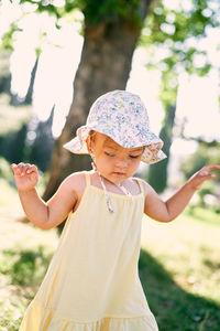 Full length of cute girl standing outdoors