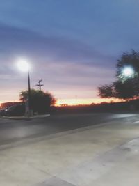 View of road against sky at sunset