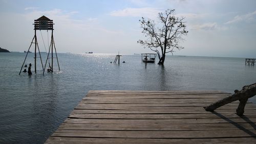 Pier over sea against sky