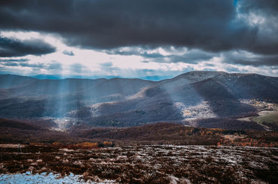 Scenic view of snowcapped mountains against sky