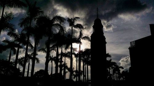 Low angle view of silhouette palm trees against sky during sunset