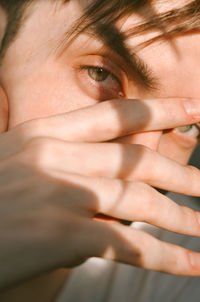 Close-up portrait of young men at golden hour