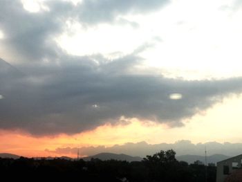 Low angle view of silhouette trees against sky during sunset