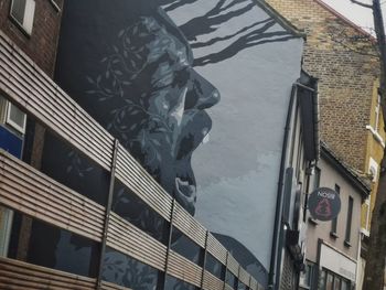 Low angle view of statue against building