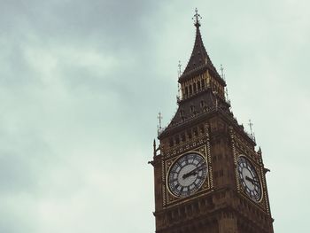 Low angle view of clock tower against sky