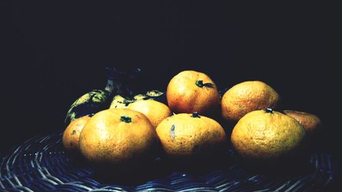 Close-up of fruit over white background