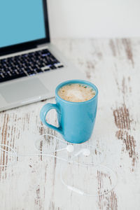 Close-up of coffee cup on table