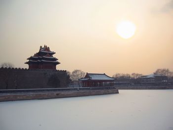 Building against sky during winter