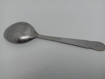 High angle view of spoon on white background