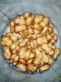 High angle view of chopped coffee in bowl on table