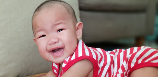 Portrait of cute baby girl at home