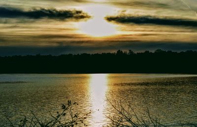 Scenic view of lake against sky during sunset