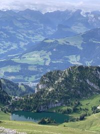 Scenic view of landscape and mountains against sky