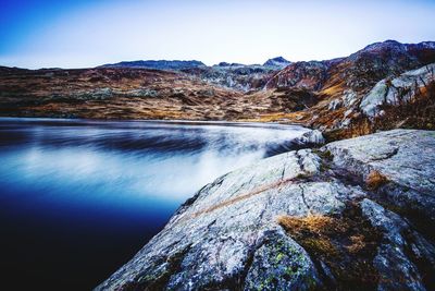 Scenic view of waterfall against sky