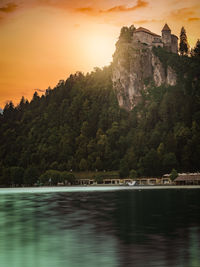 Scenic view of lake against sky during sunset