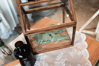 High angle view of glass bottles on table at home