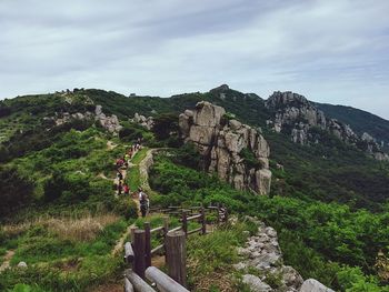 Scenic view of mountains against cloudy sky