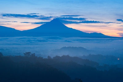 Scenic view of mountains against sky during sunset