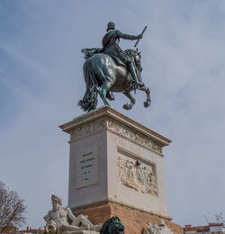 Low angle view of statue against sky