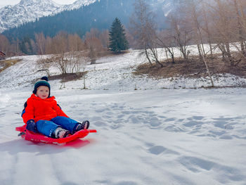 Man skiing on snow covered field