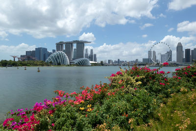 Scenic view of sea and buildings against sky